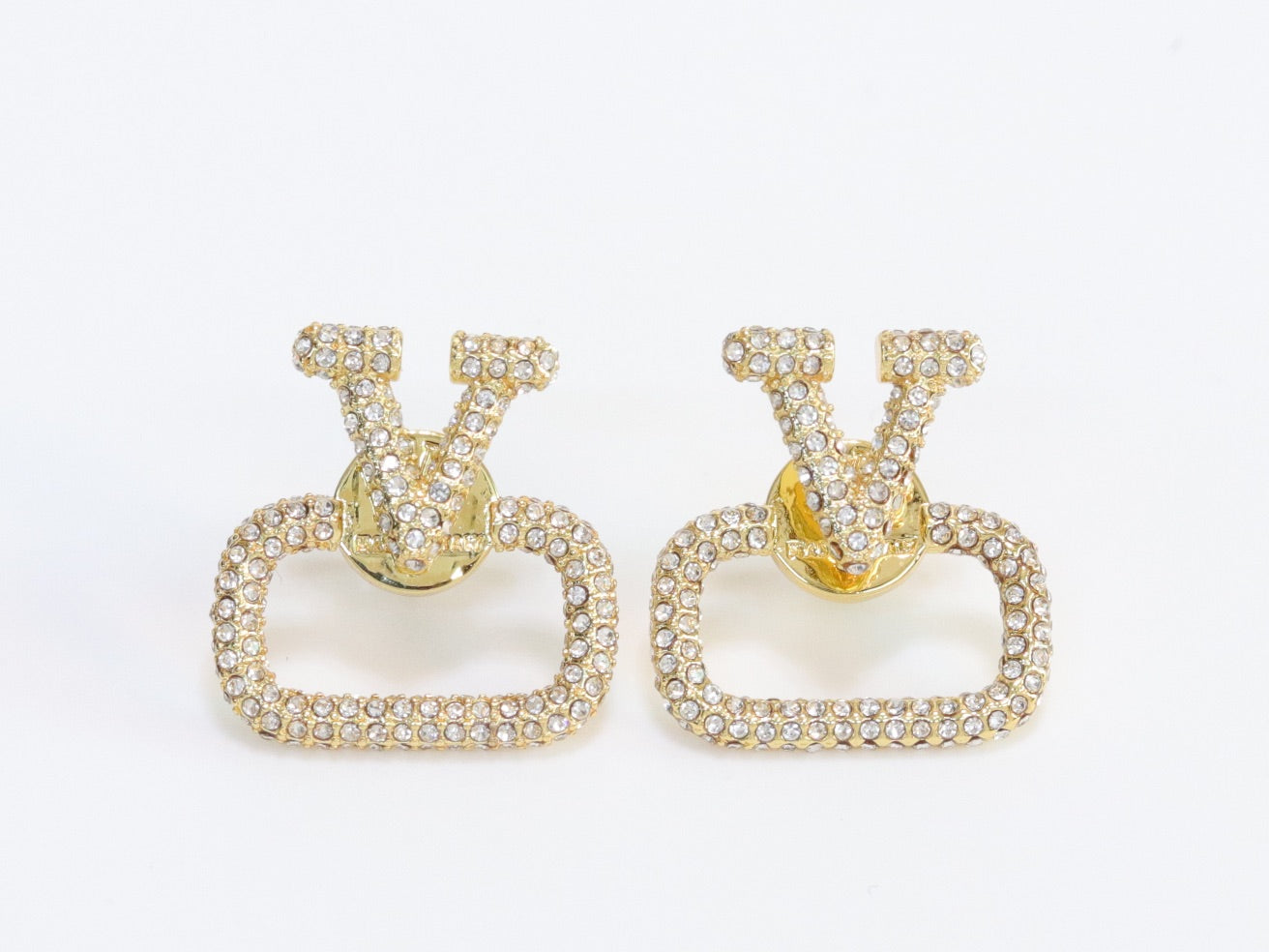 Alphabet V cz studs in gold finish