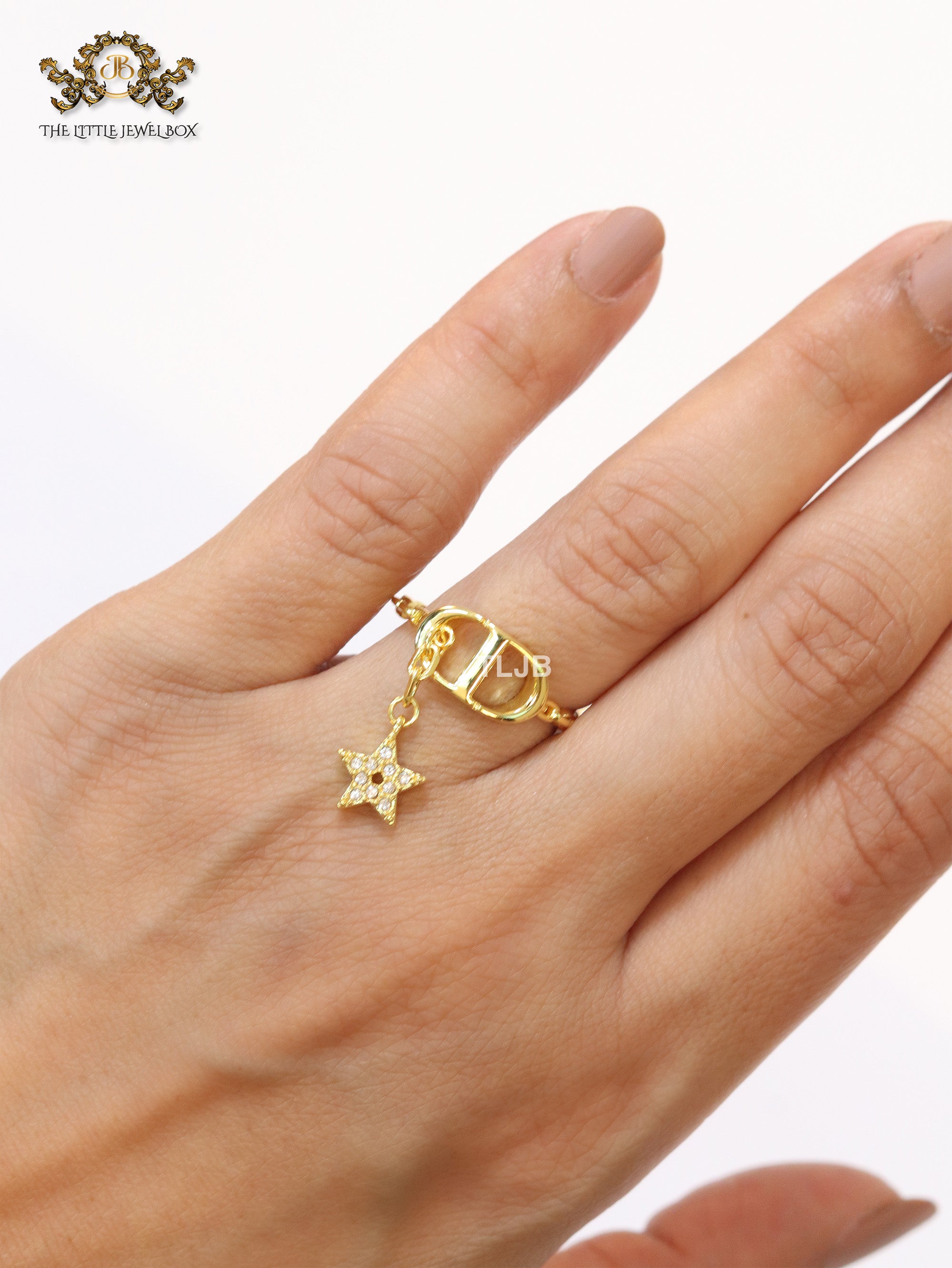 Open V with star charm ring