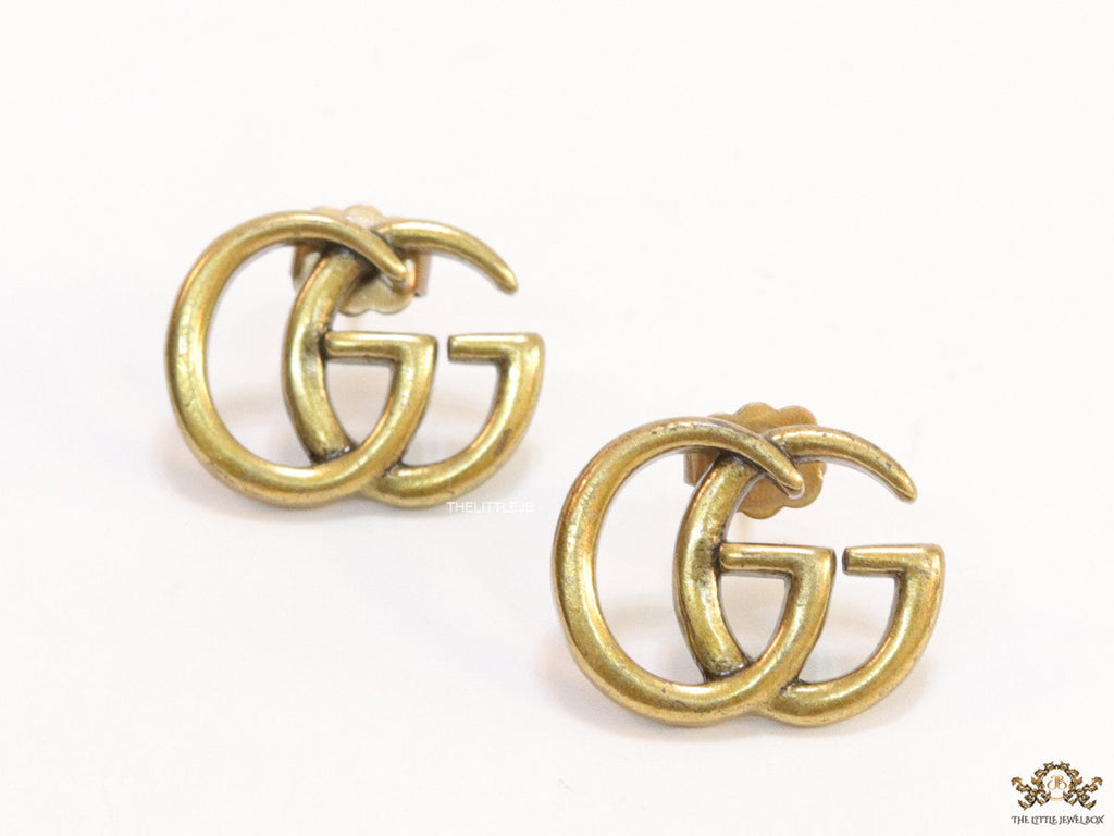 Gold plated twin G alphabet stud earrings