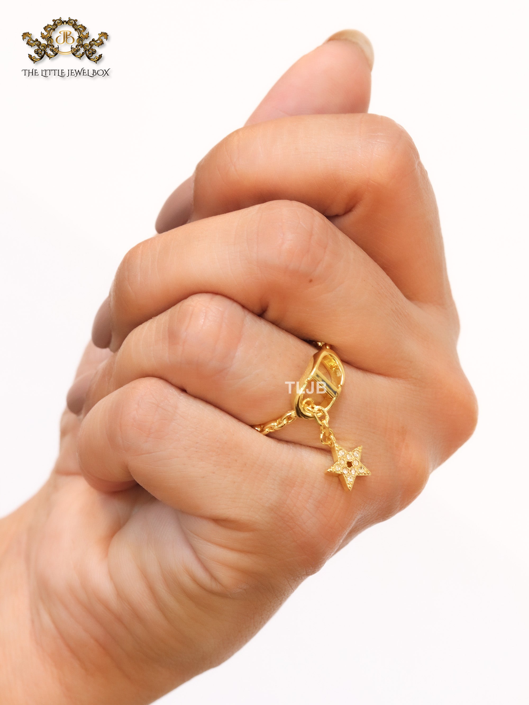 Open V with star charm ring