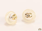 White acrylic studs with pearl and twin C motif