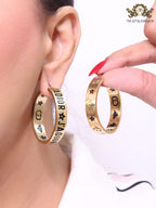 Alphabet C and D embossed on gold hoops