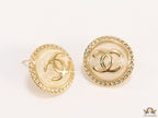 Twin C motif gold plated round studs on pearly cream acrylic base