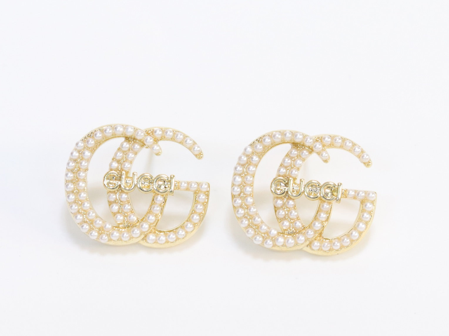 Double G pearl earrings in gold finish