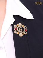 Double G embossed rustic brooch with multi coloured stones