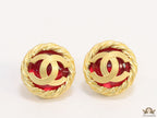 Twin C motif matt gold plated round studs on red base