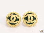Twin C motif matt gold plated round studs on deep green base