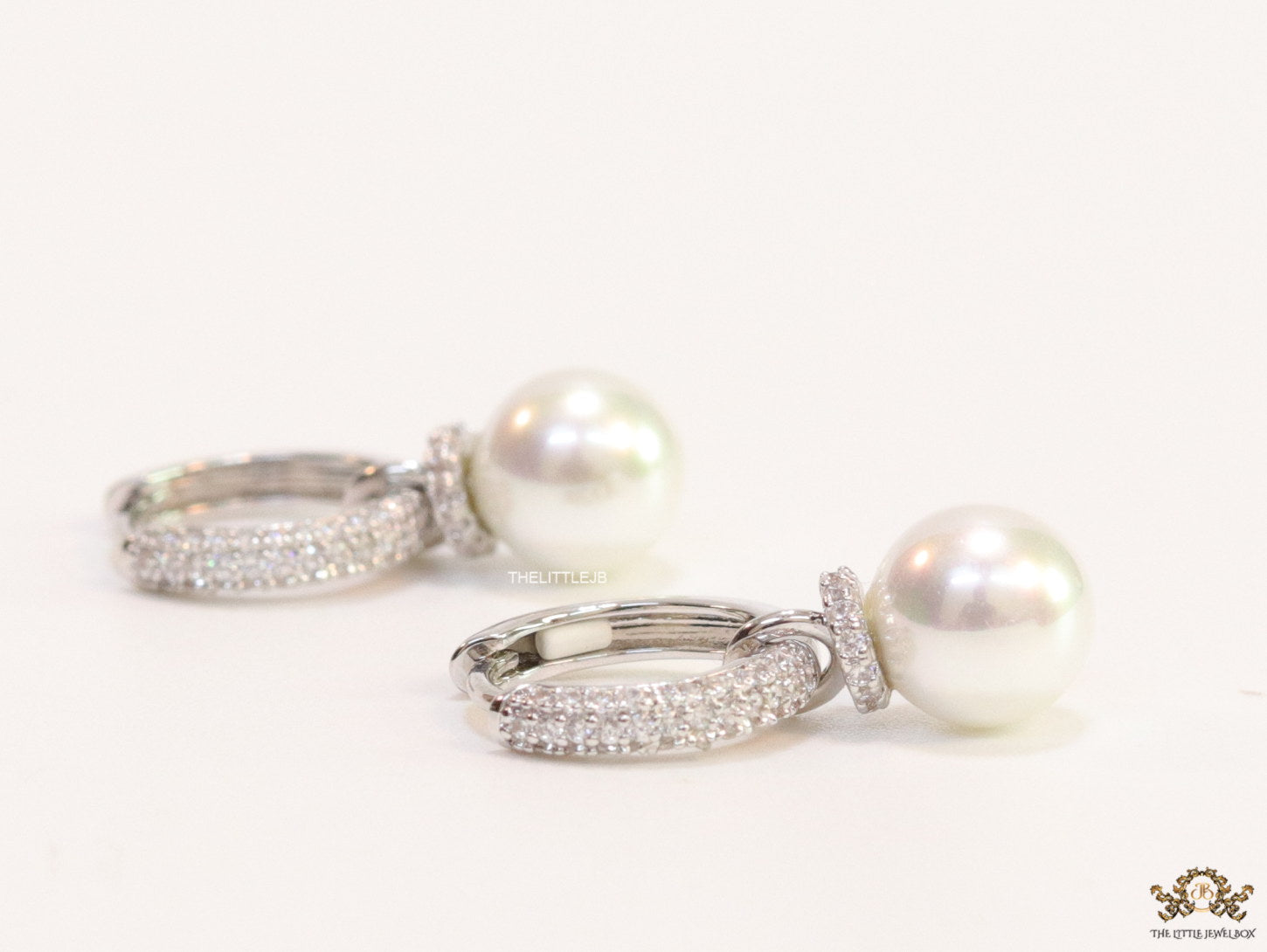 Platinum plated cz hoops with pearl drop