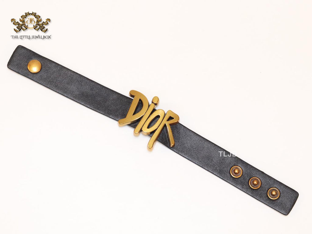 Alphabet D and black belted bracelet