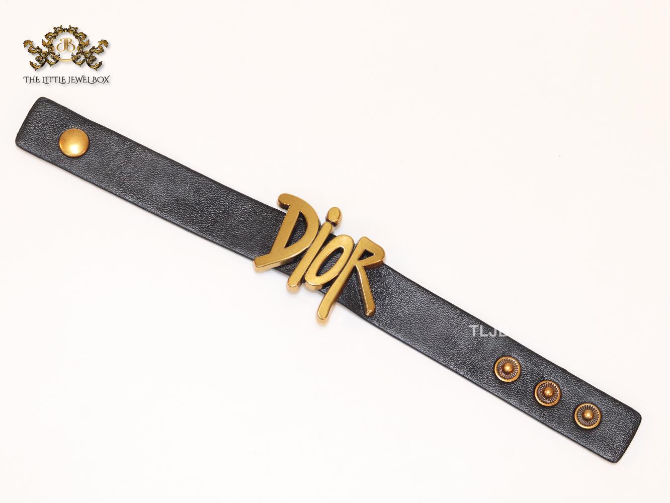 Alphabet D and black belted bracelet