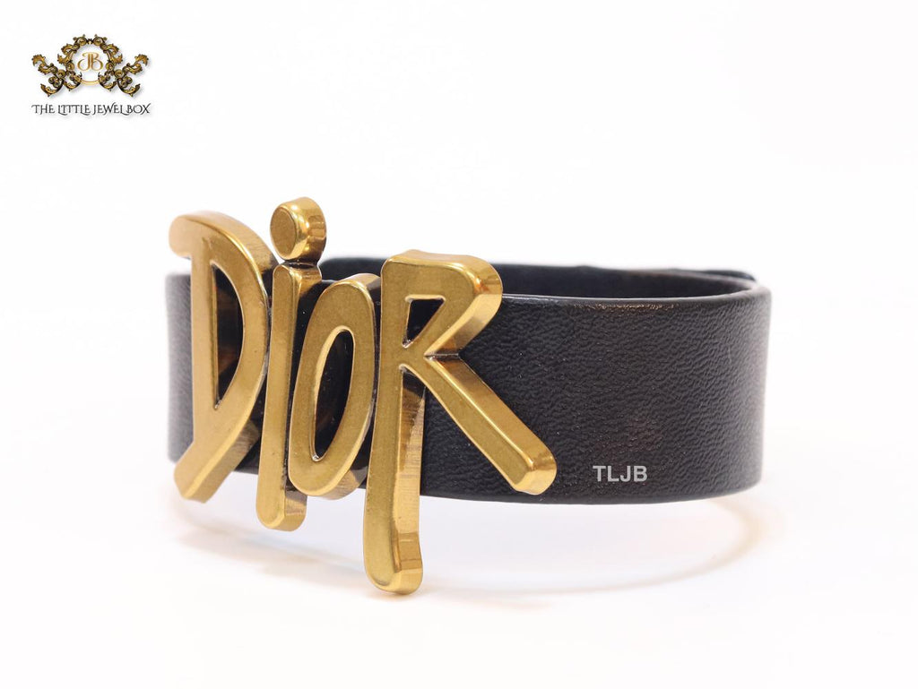 Alphabet D and black belted bracelet