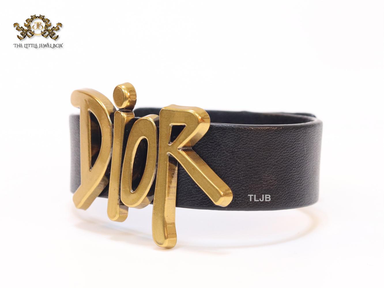 Alphabet D and black belted bracelet