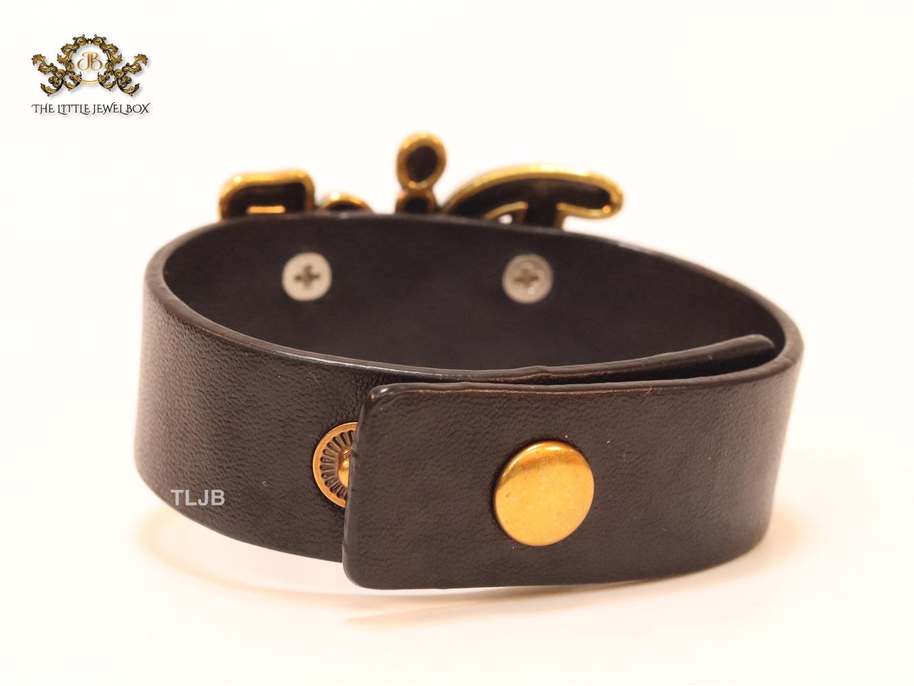 Alphabet D and black belted bracelet