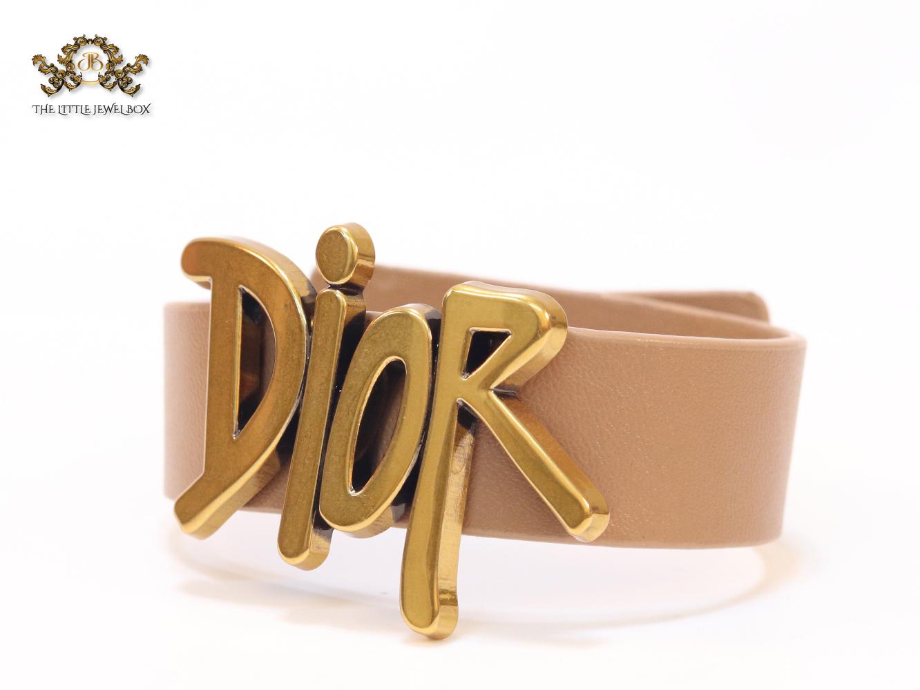 Alphabet D and tan belted bracelet