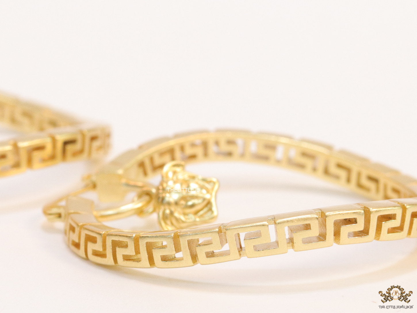 Designer golden twisted hoops 52 mm