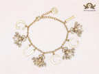Double G bracelet with rustic charms bracelet