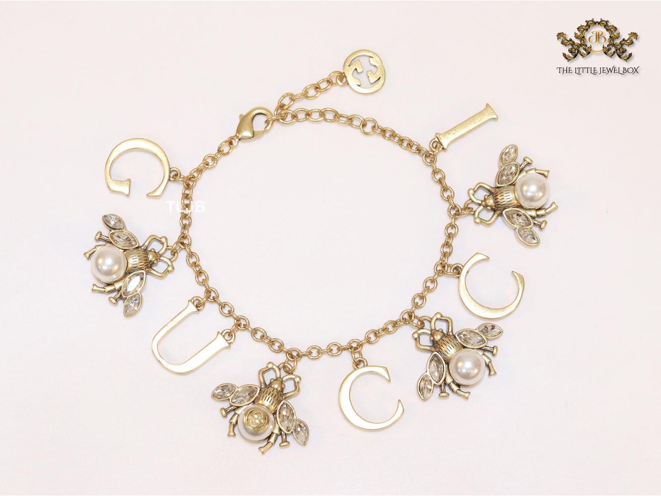 Double G bracelet with rustic charms bracelet