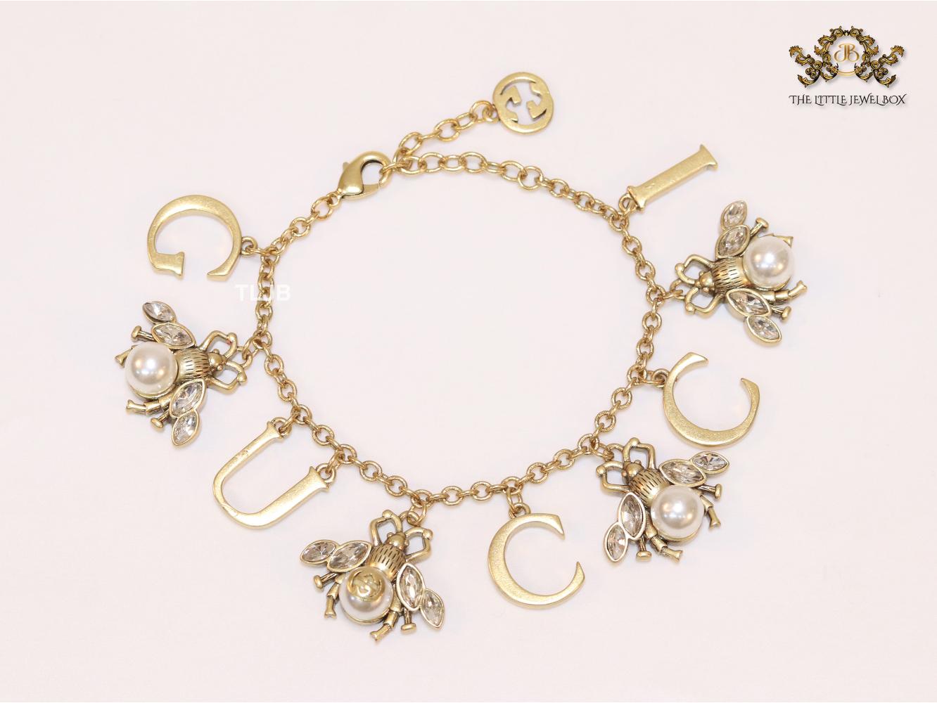 Double G bracelet with rustic charms bracelet