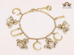 Double G bracelet with rustic charms bracelet