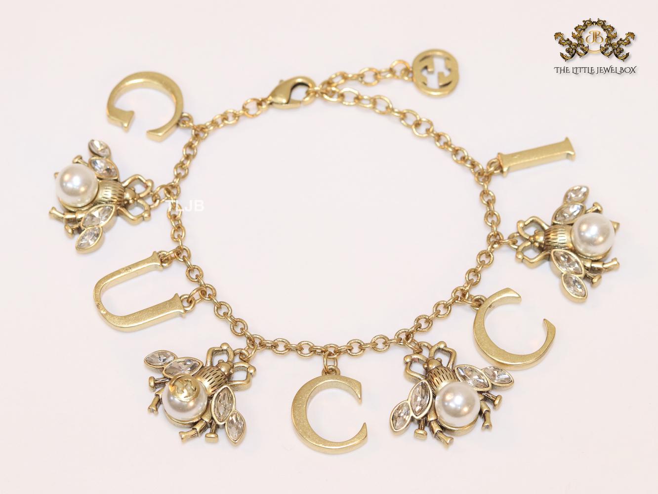 Double G bracelet with rustic charms bracelet