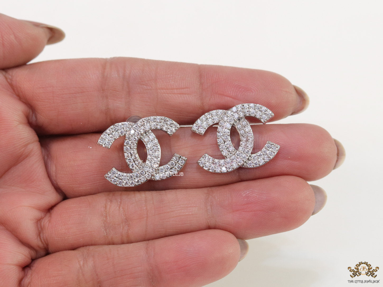 Platinum plated twin C motif cz studs