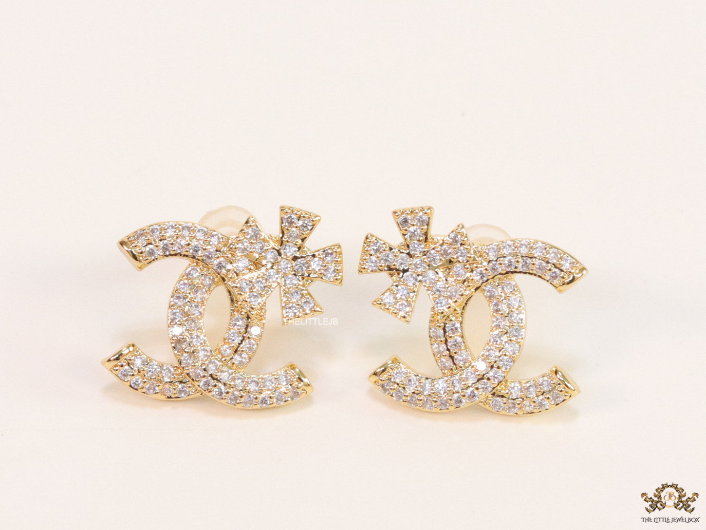 Gold plated flower and twin C motif cz studs