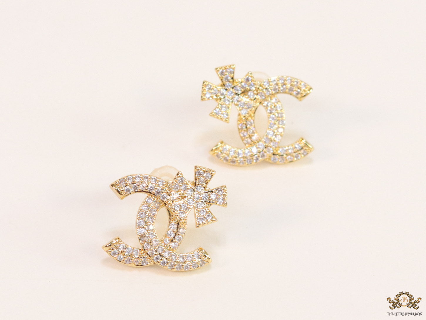 Gold plated flower and twin C motif cz studs