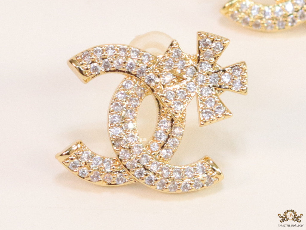 Gold plated flower and twin C motif cz studs