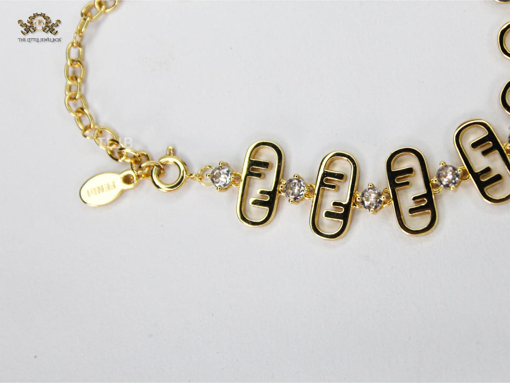 Alphabet F studded gold bracelet