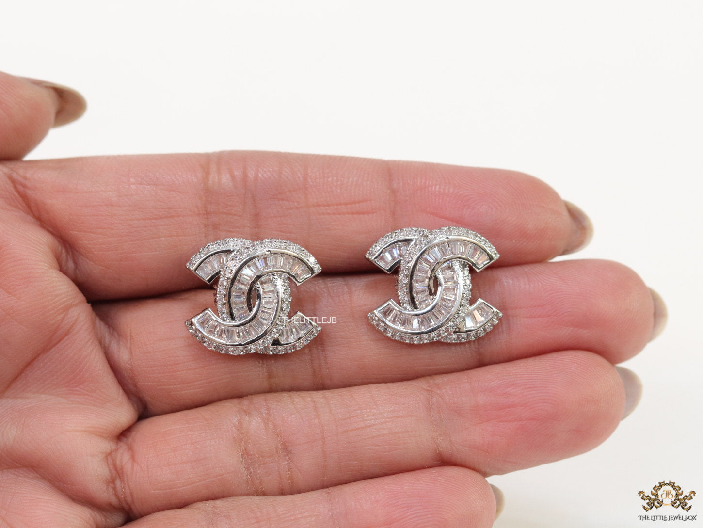 Platinum plated twin C motif cz baguette studs