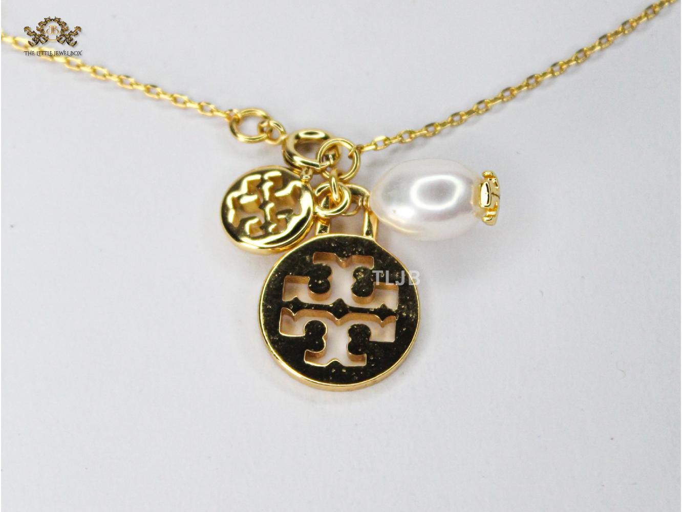 Three charm gold toned bracelet