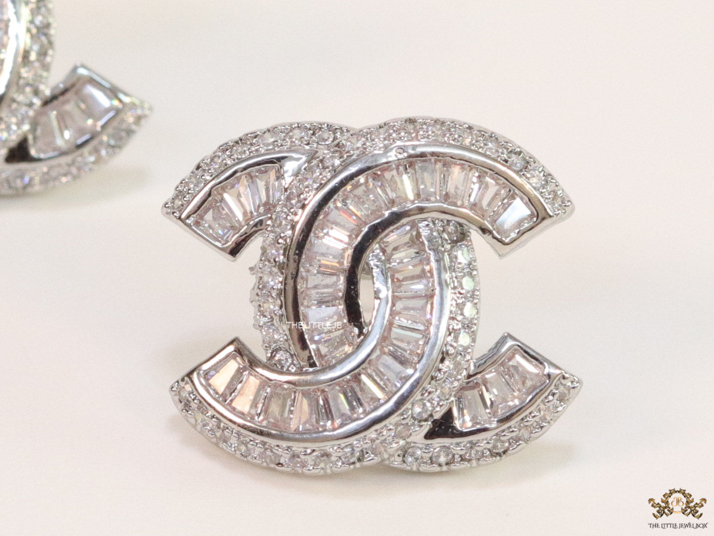 Platinum plated twin C motif cz baguette studs