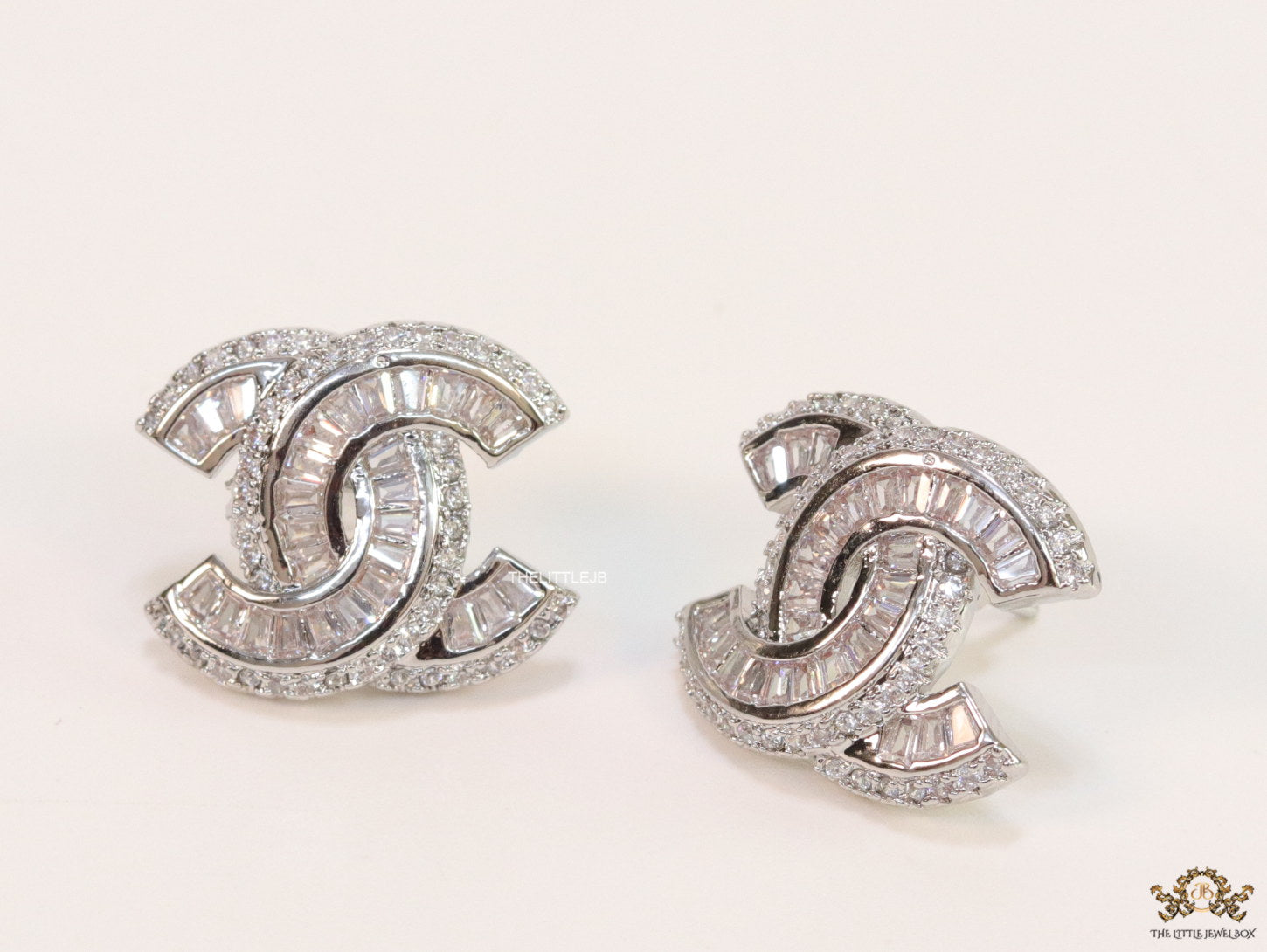 Platinum plated twin C motif cz baguette studs