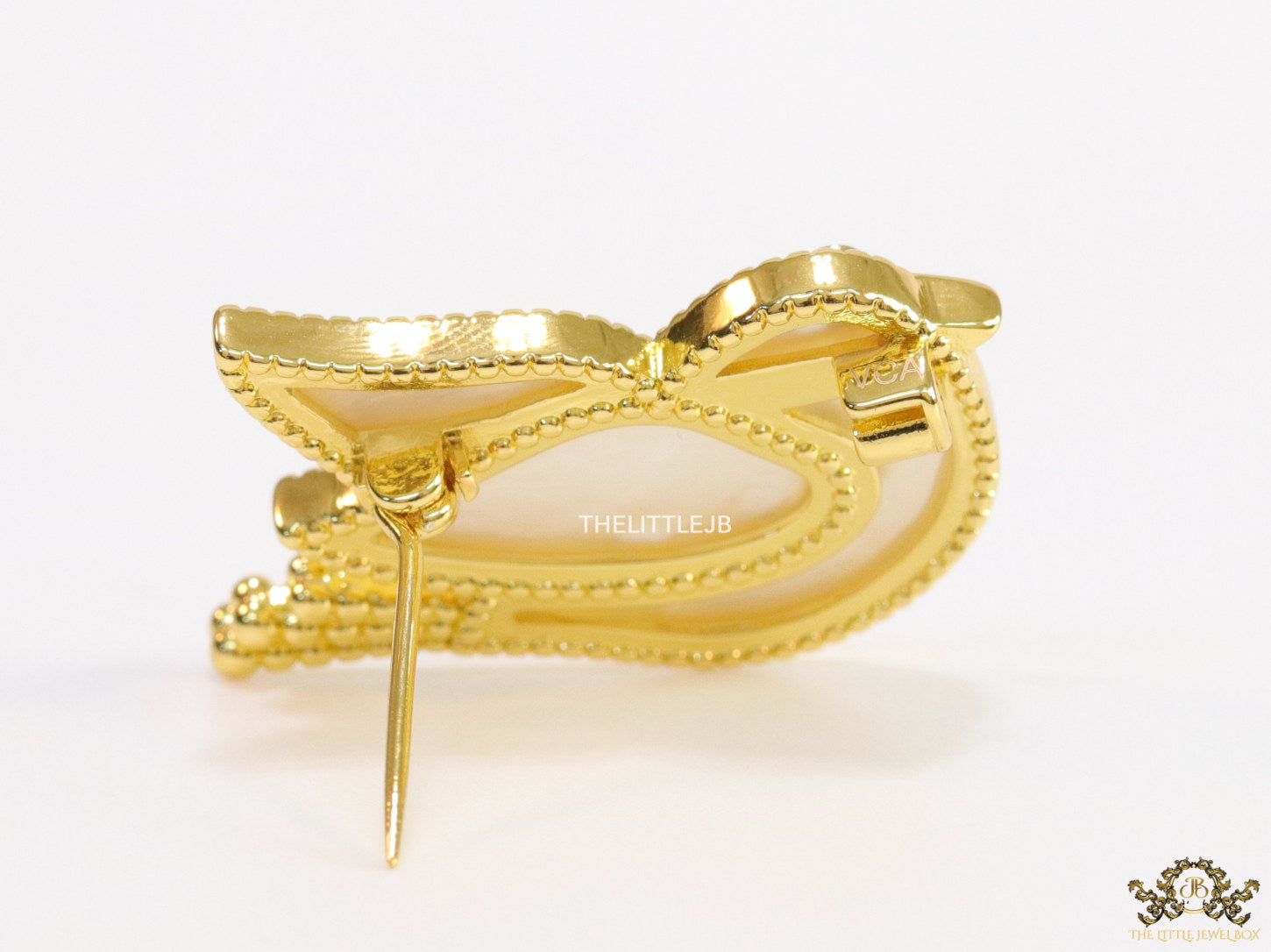 Gold plated white bird brooch