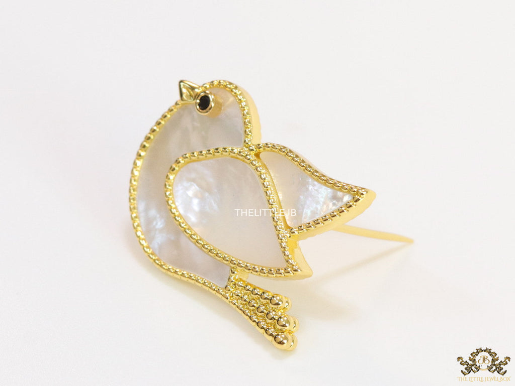 Gold plated white bird brooch
