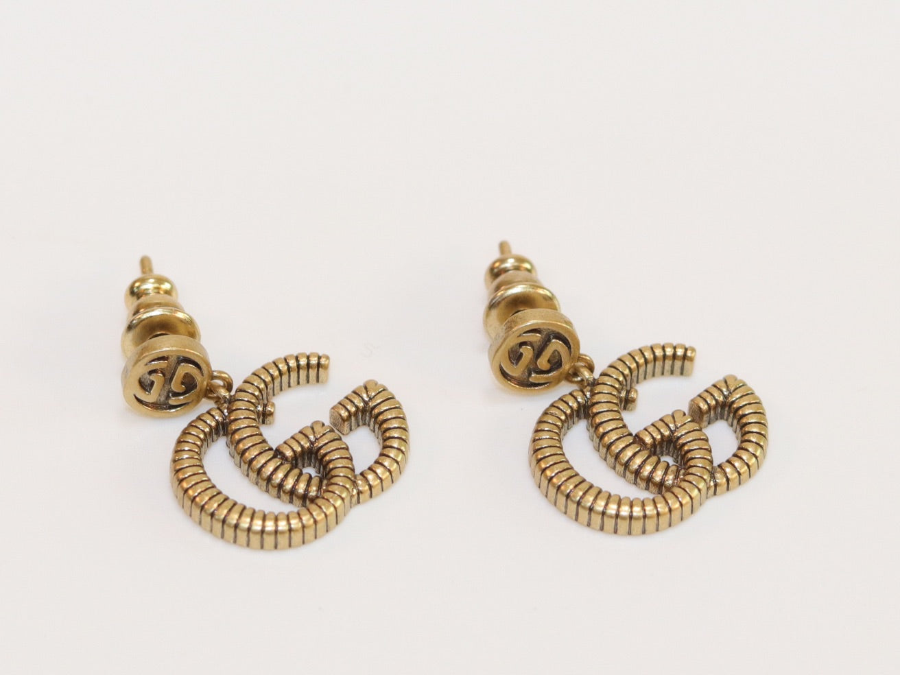 Double G rustic gold stud dangles