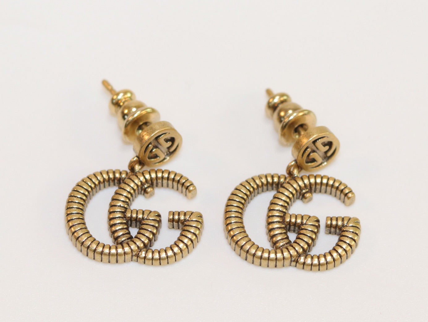 Double G rustic gold stud dangles