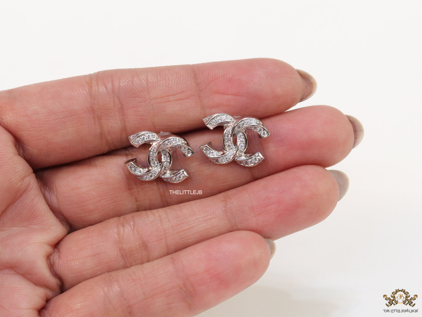 Platinum plated entwined twin C motif cz studs