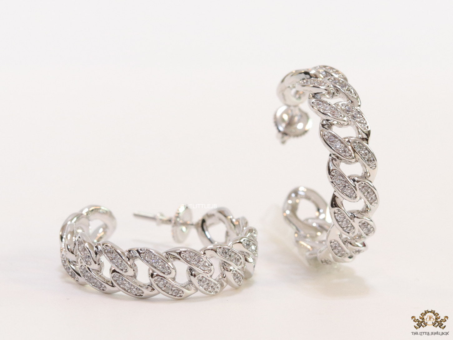 Platinum plated open cz hoops in link chain pattern