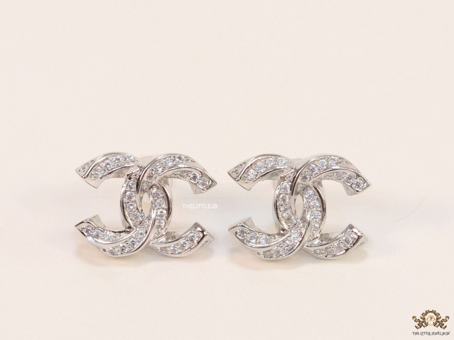Platinum plated entwined twin C motif cz studs