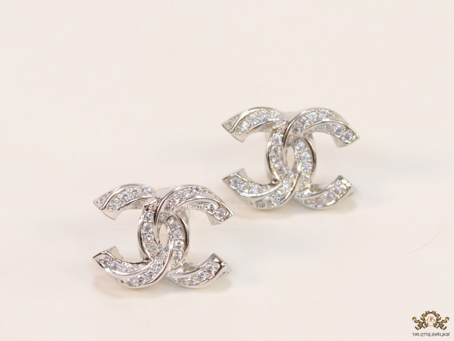 Platinum plated entwined twin C motif cz studs