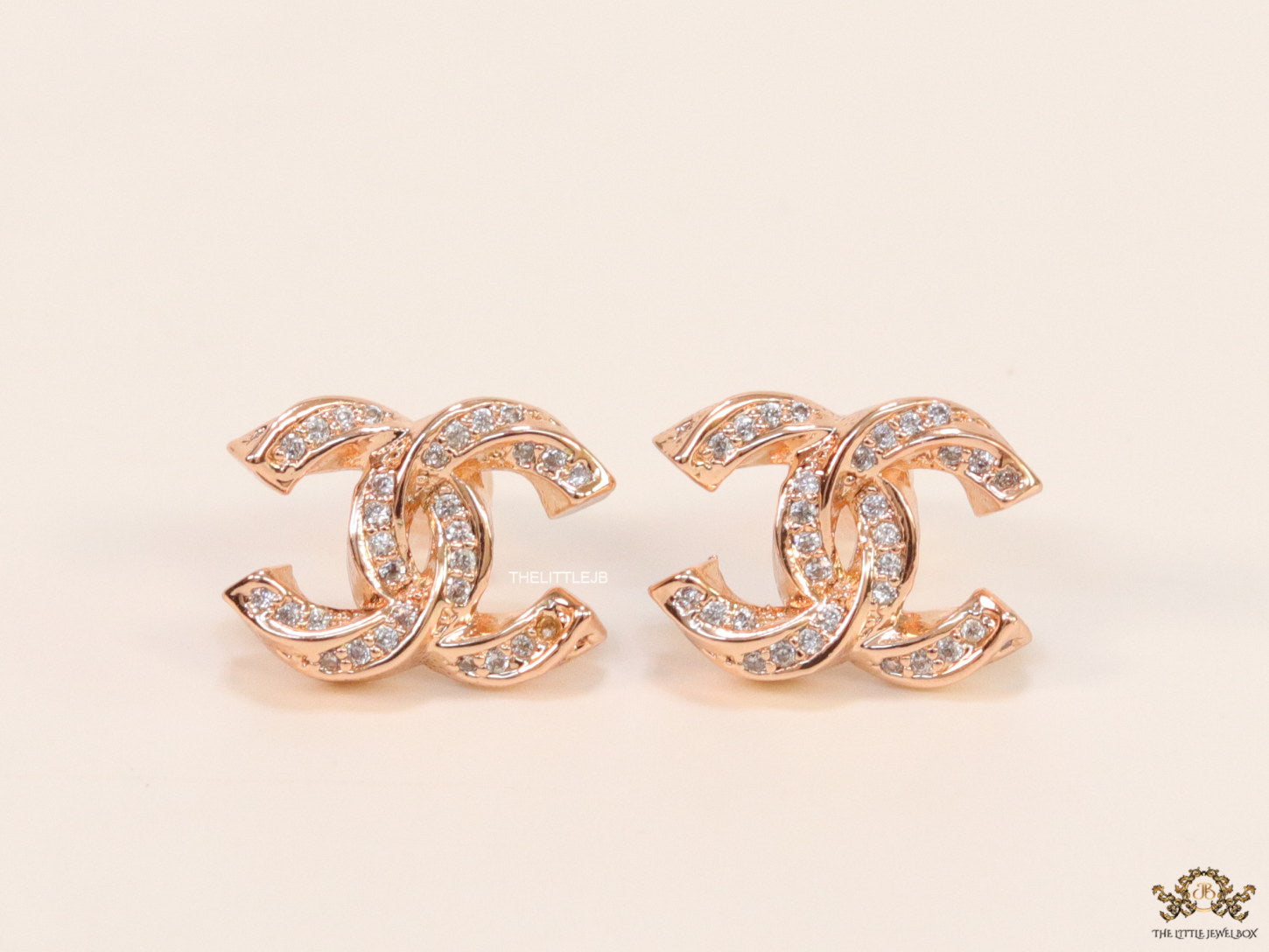 Rose gold plated entwined twin C motif cz studs
