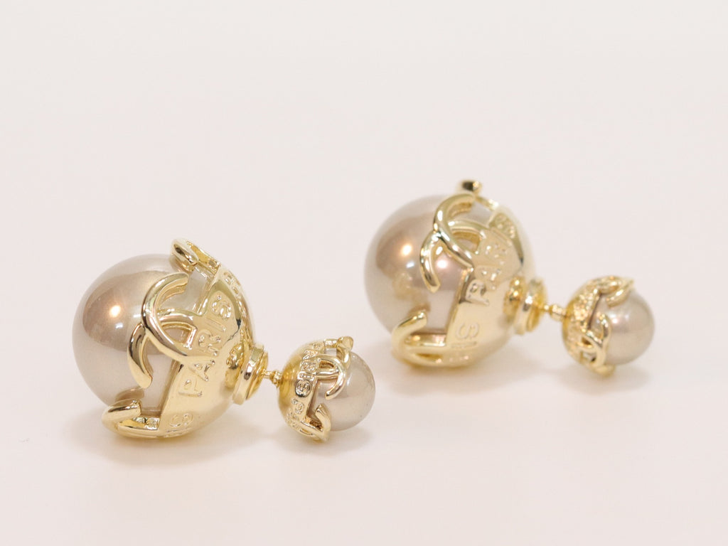 Double C beige pearl studs in gold finish