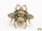 Antique gold finish bee brooch with white and red stones and blue details