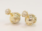 Double C beige pearl studs in gold finish