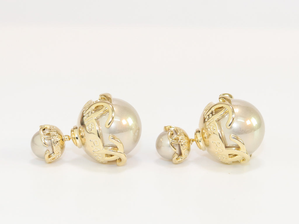 Double C beige pearl studs in gold finish