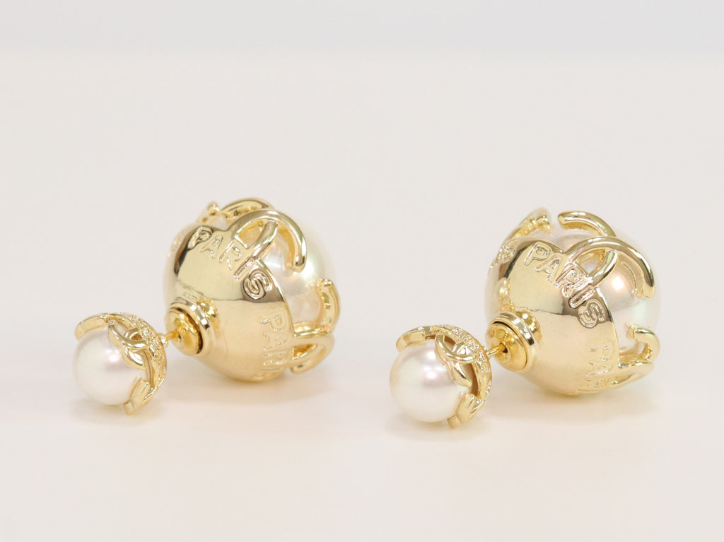 Double C white pearl studs in gold finish