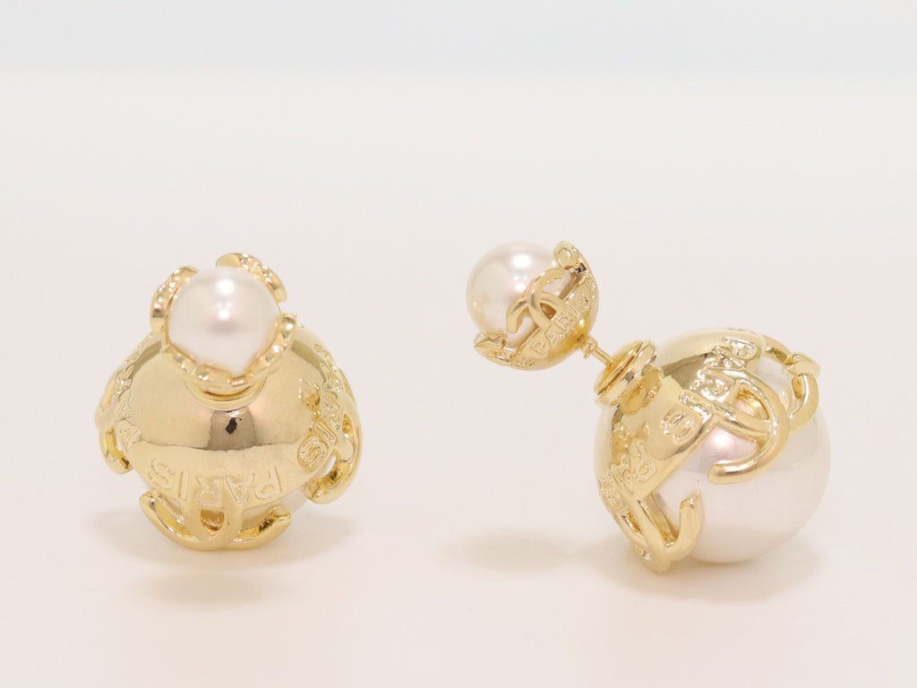 Double C white pearl studs in gold finish