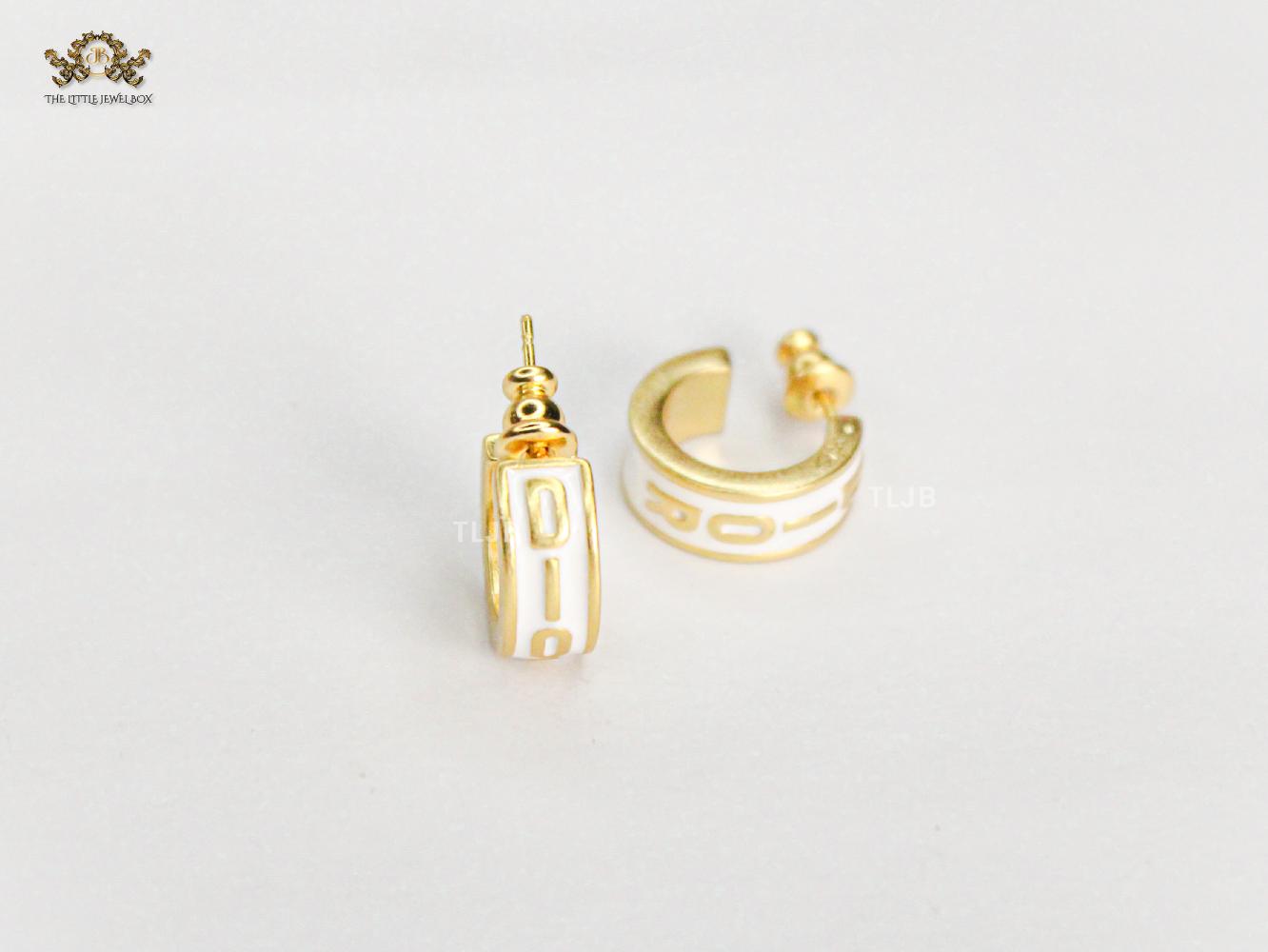 Alphabet D white hoops with gold detailing