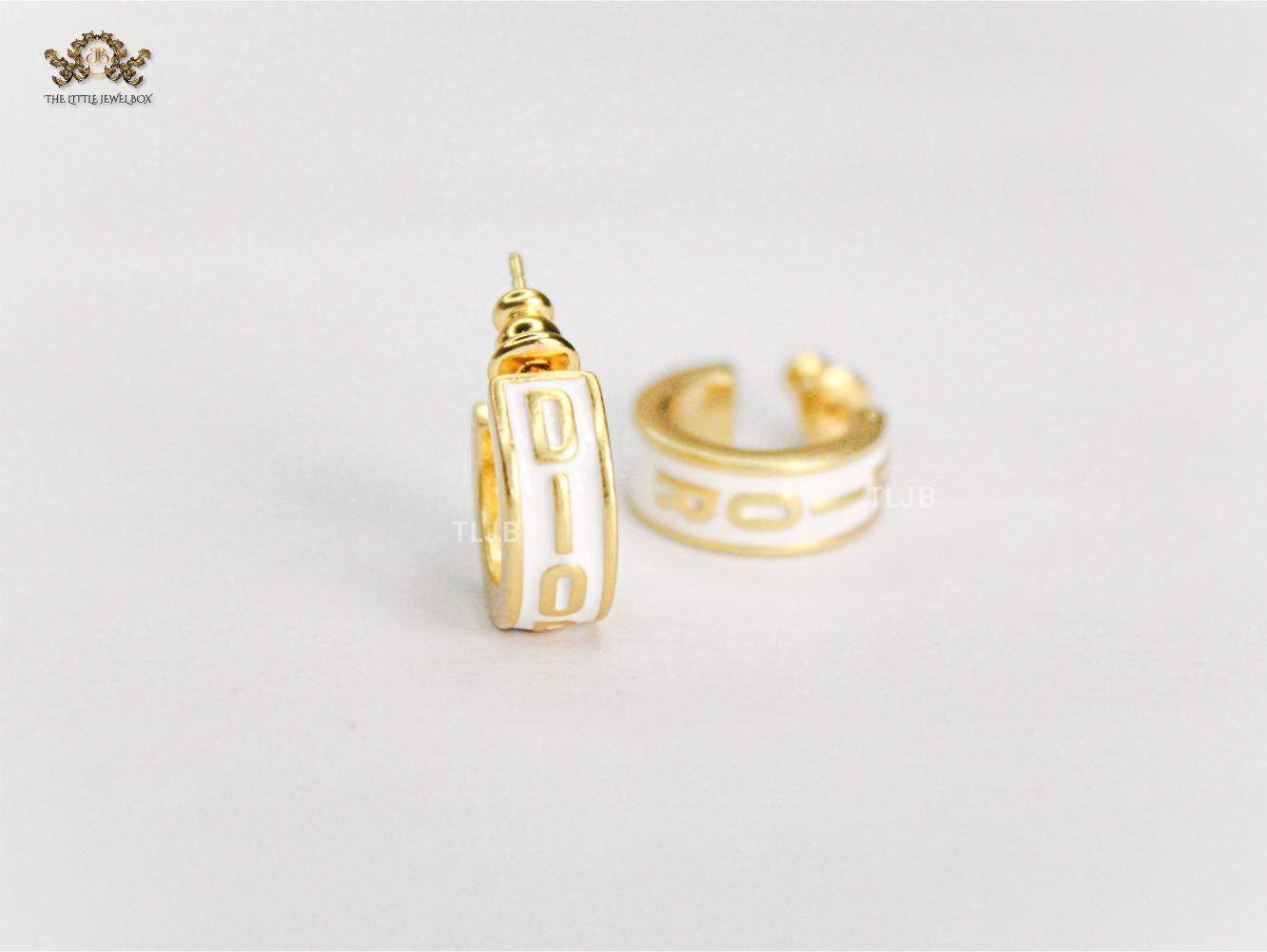 Alphabet D white hoops with gold detailing